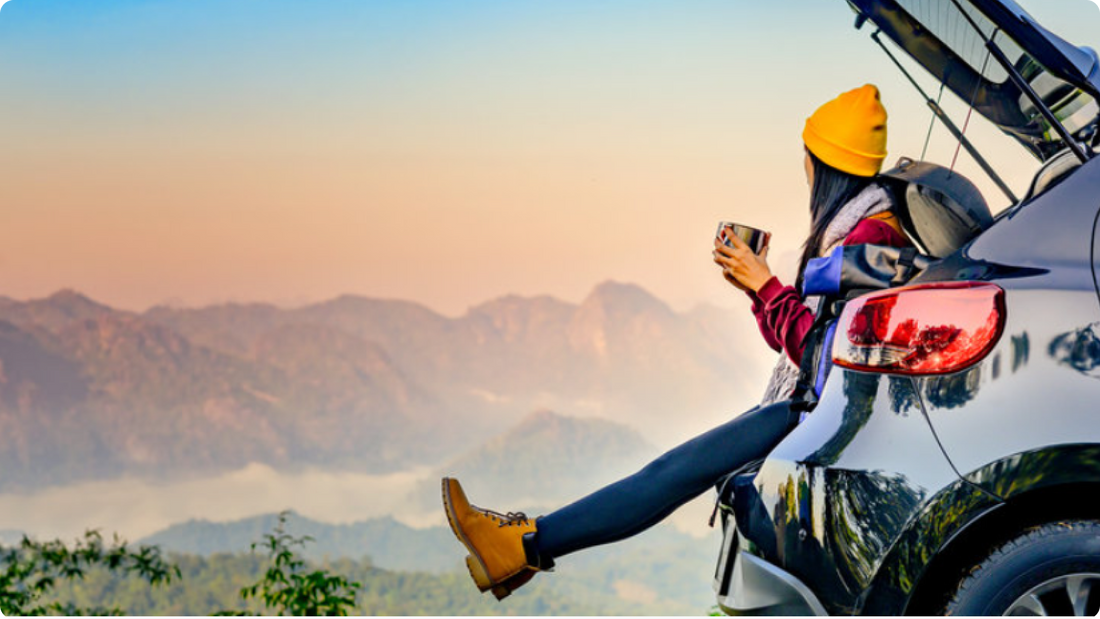 woman enjoying coffee while travelling in the great outdoors