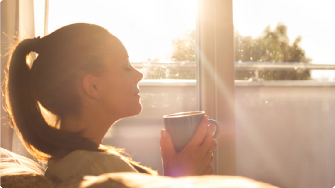 woman drinking a cup coffee in the morning