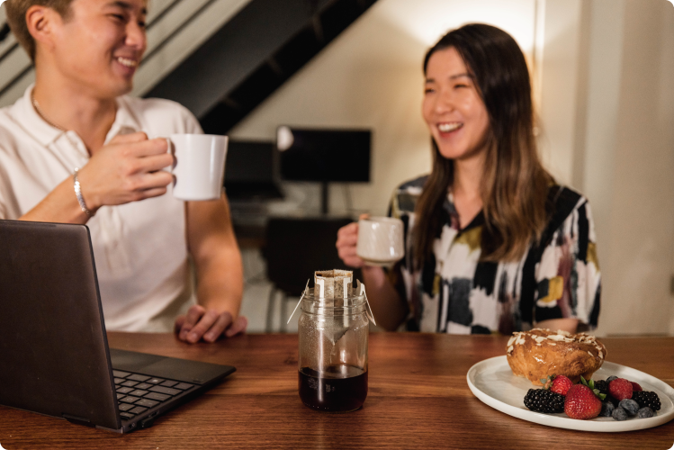 Two friends having a conversation over coffee