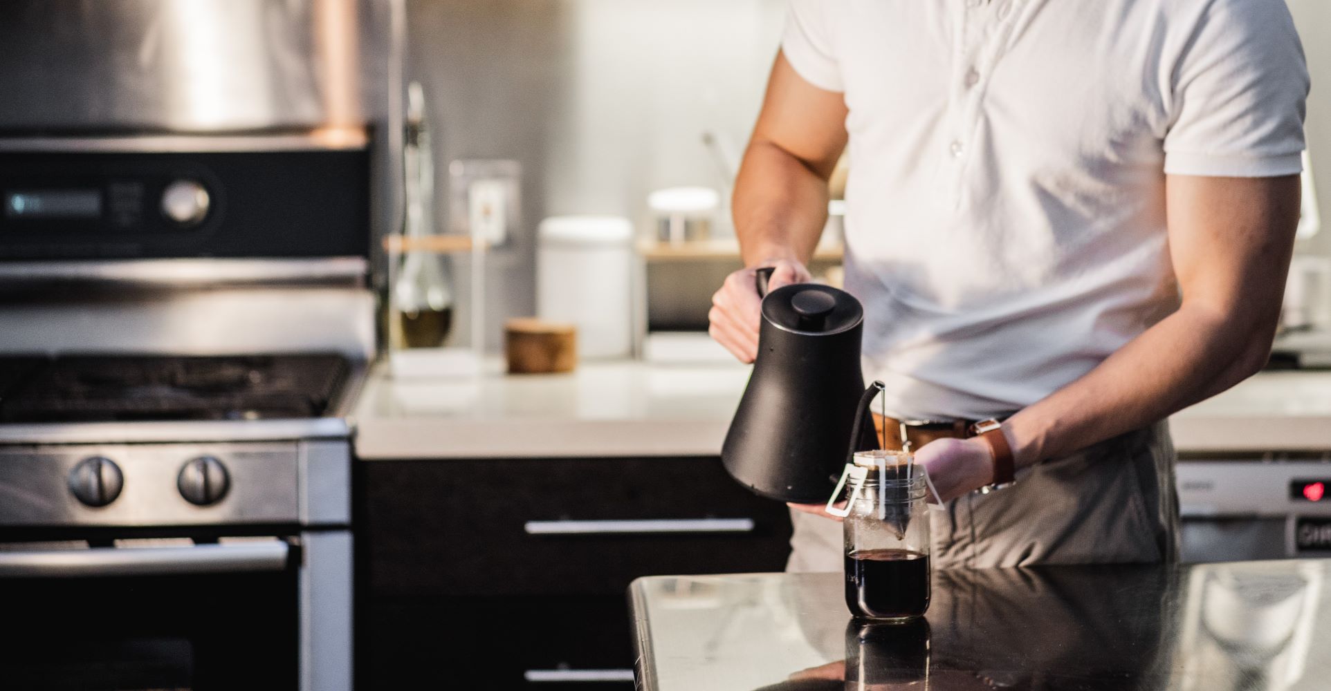 Male making coffee before work using single-serve pour over coffee pouches