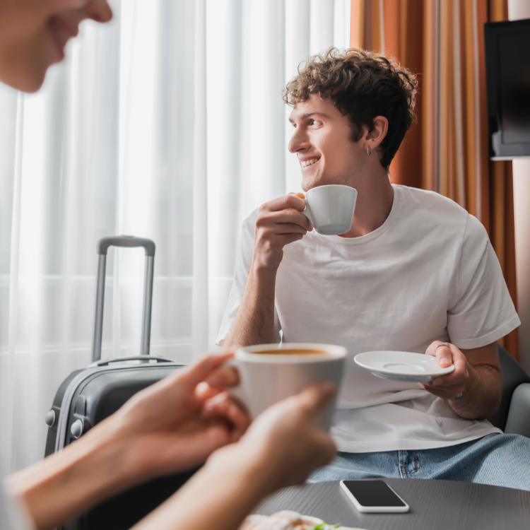 People drinking coffee in a hotel room